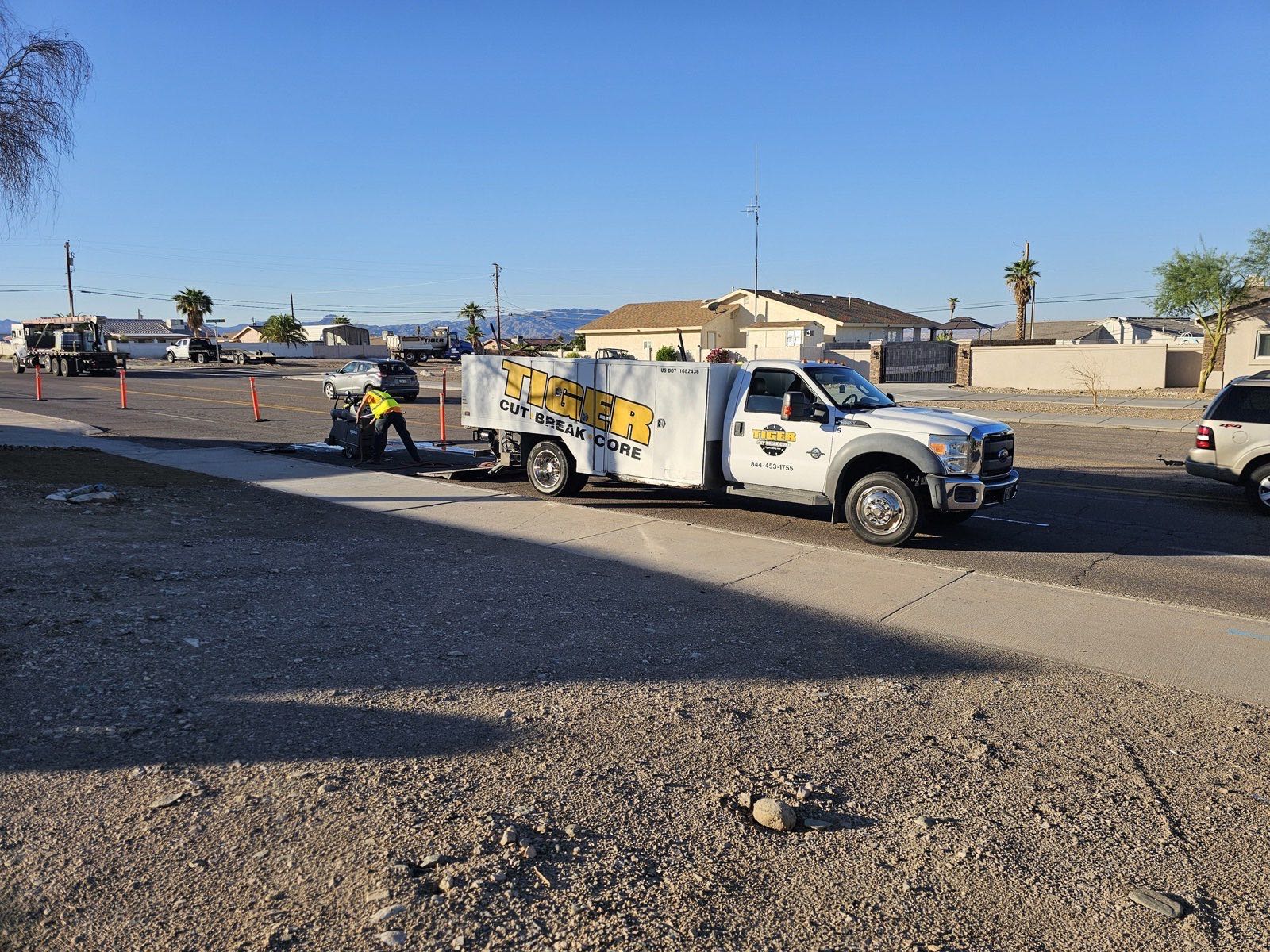 Tiger Trenching truck staged at a roadside utility job